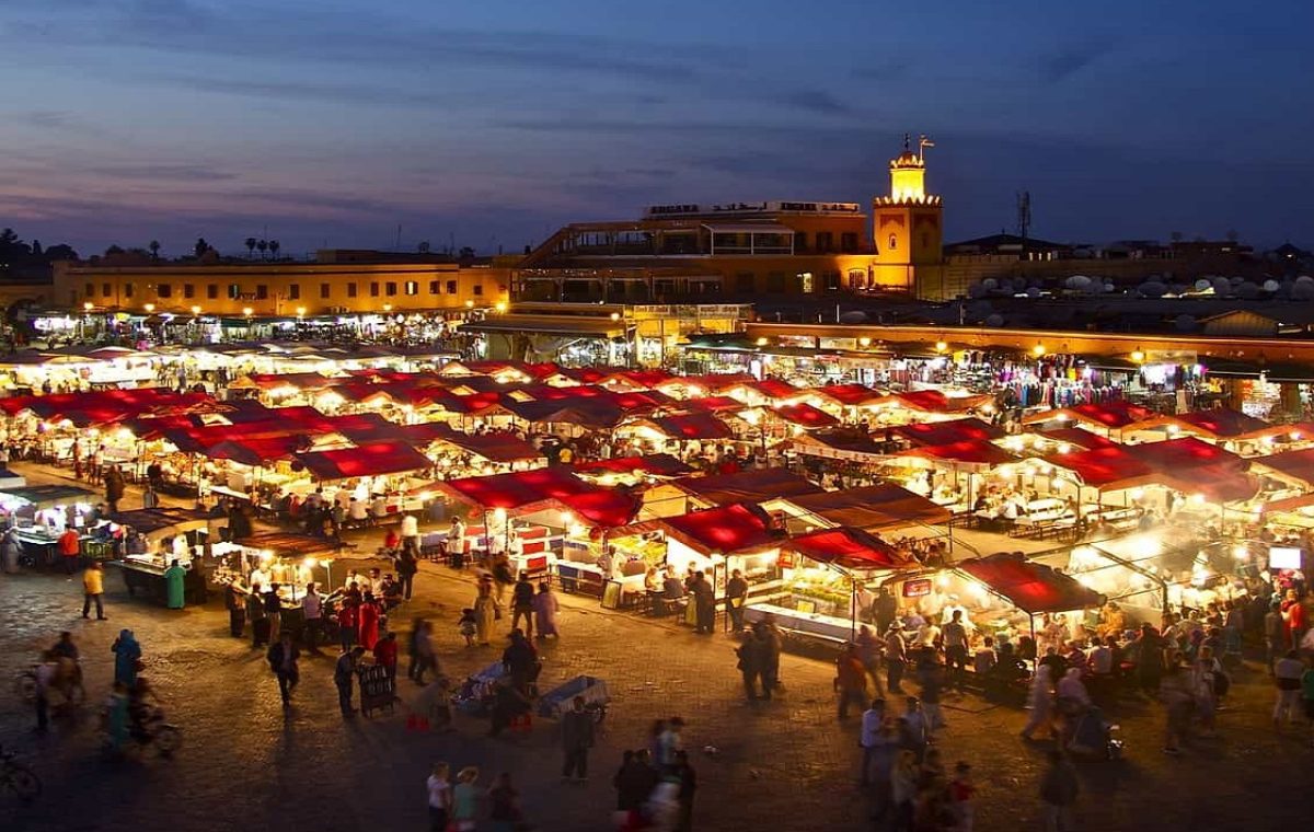 Food stalls lit up at night on Jemaa el Fna square in Marrakech, on a Marrakech and Sahara tour