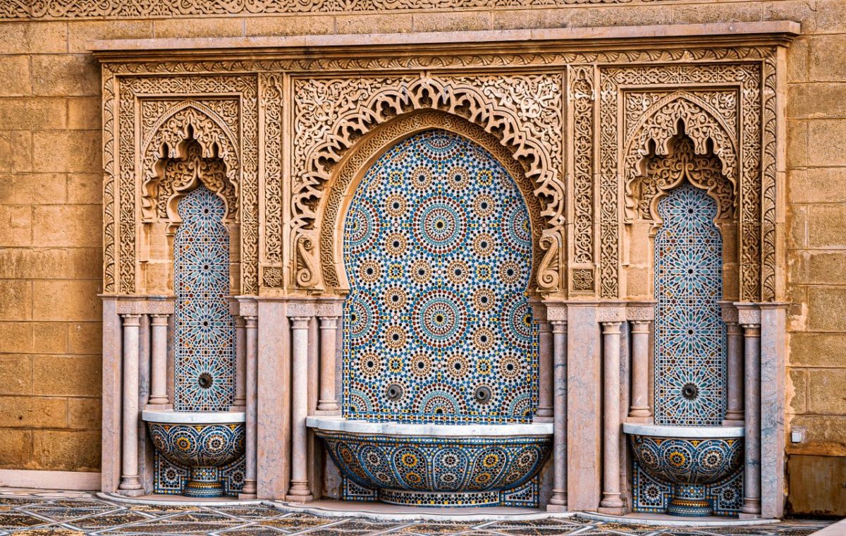 Moroccan zellige tile wall with a fountain, on a day trip from Fes